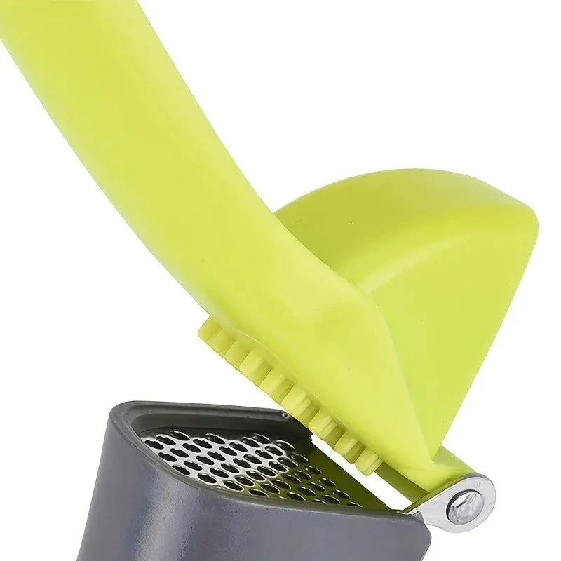 1 garlic press, a tool for crushing and squeezing garlic, a small household outdoor kitchen tool